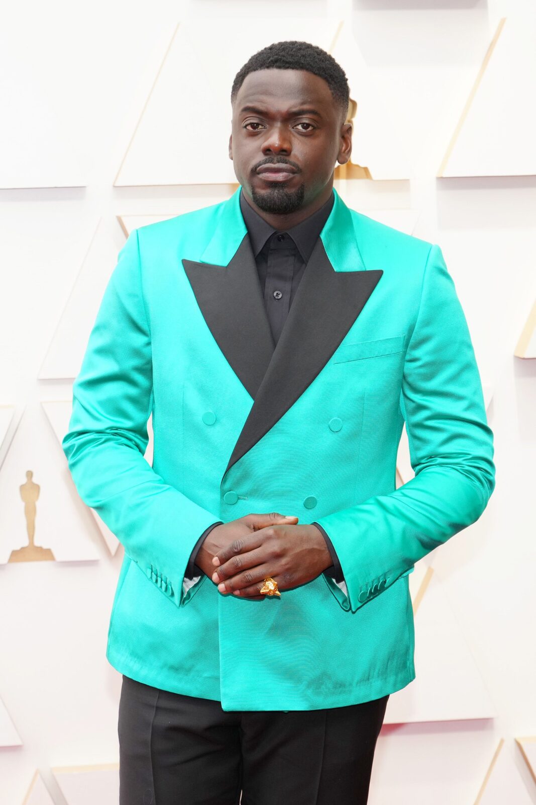 Daniel Kaluuya in bright green tux jacket with black shirt and trousers