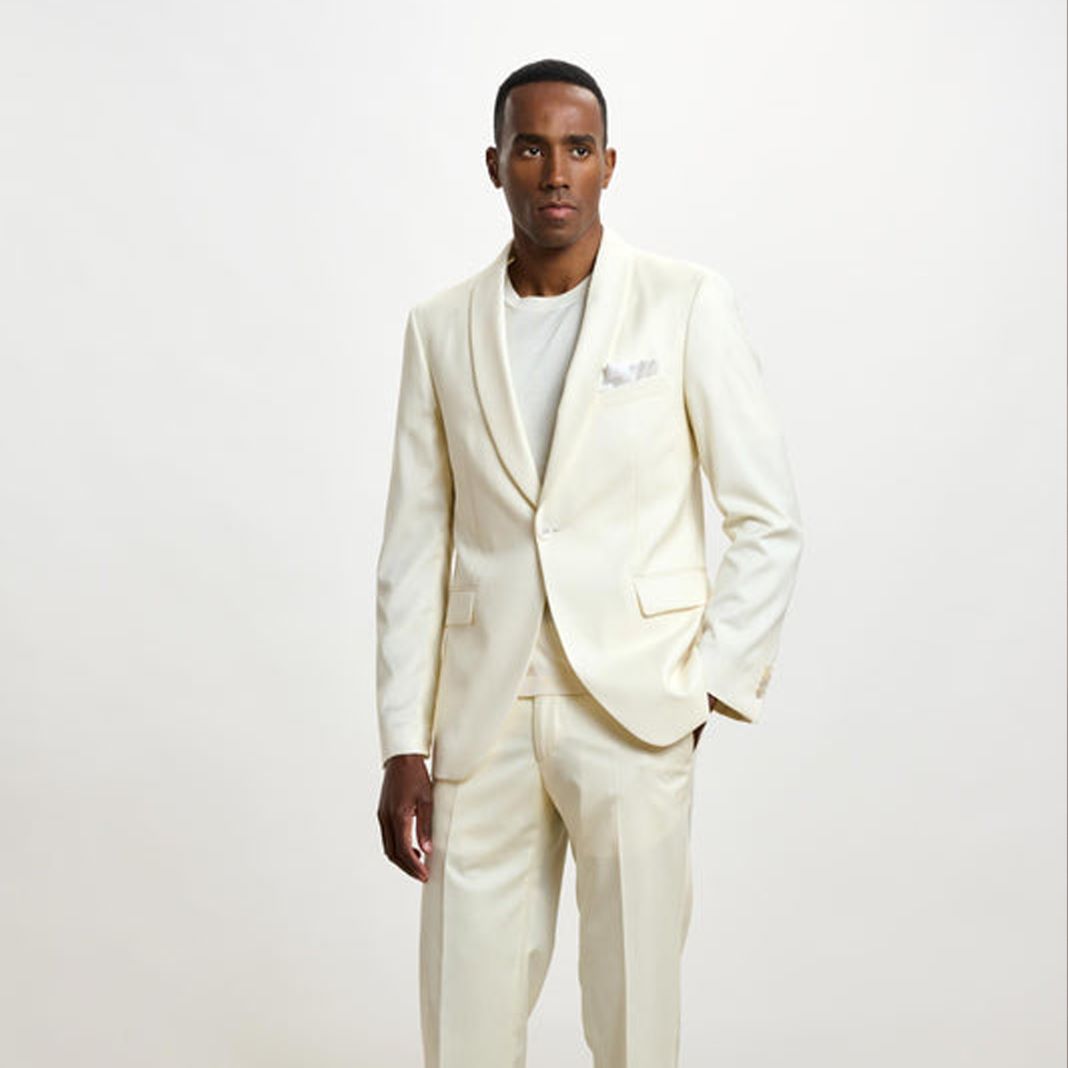 Man wearing a white/cream wedding evening suit