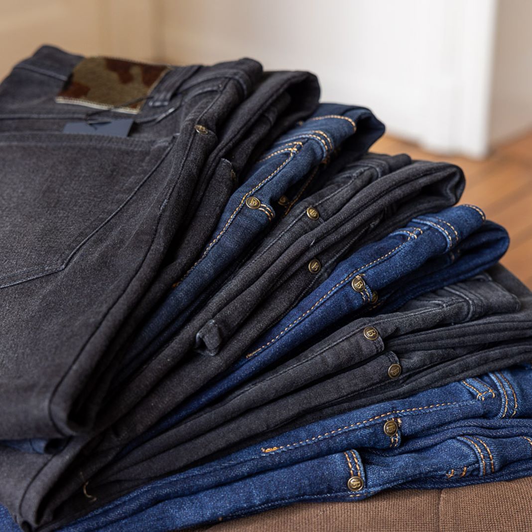 A selection of denim jeans with subtle fading and a tapered fit for a modern style