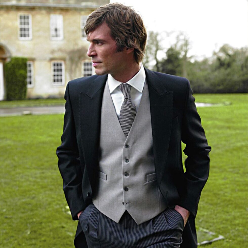 Groom in morning dress with a cravat