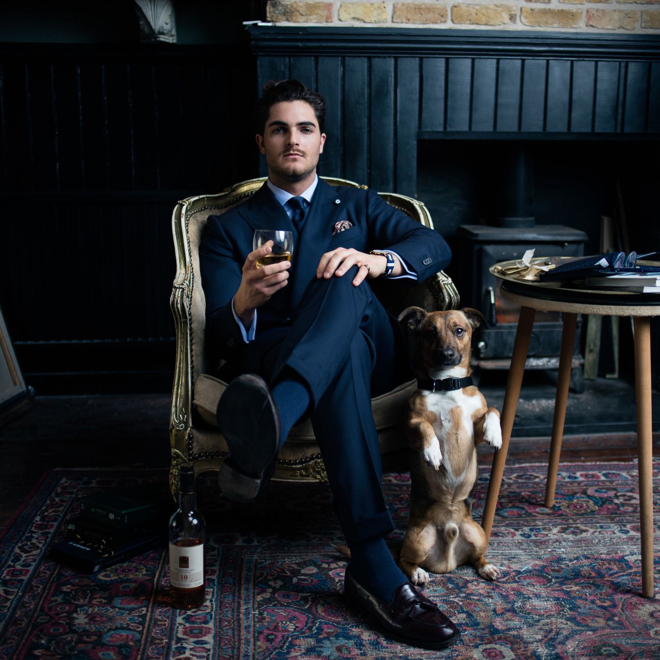 Man in a tailored business suit for work, featuring a sharp navy jacket and matching trousers.