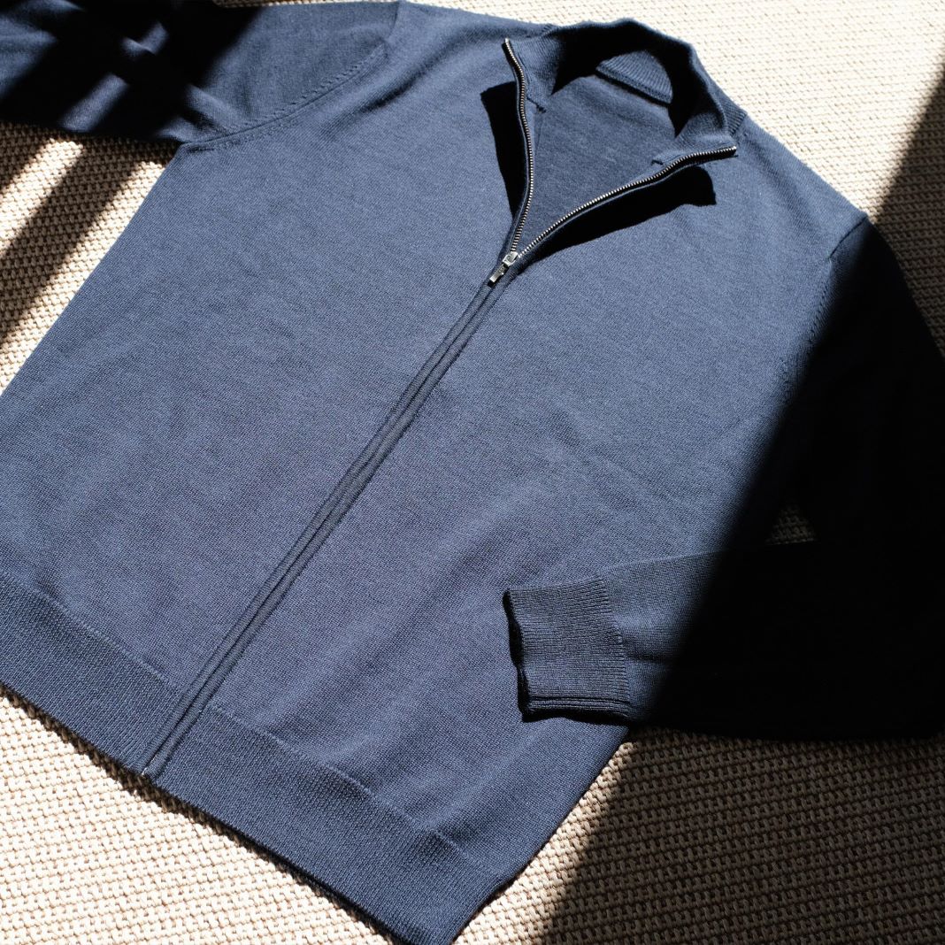 Lightweight blue sweater with a sleek, modern design for everyday wear.