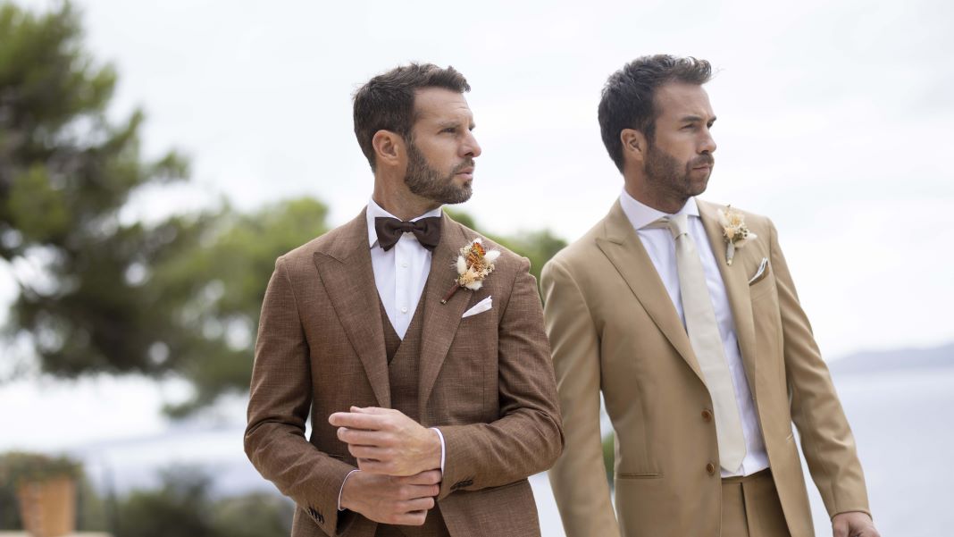 A photo of two gentlemen wearing wedding suits