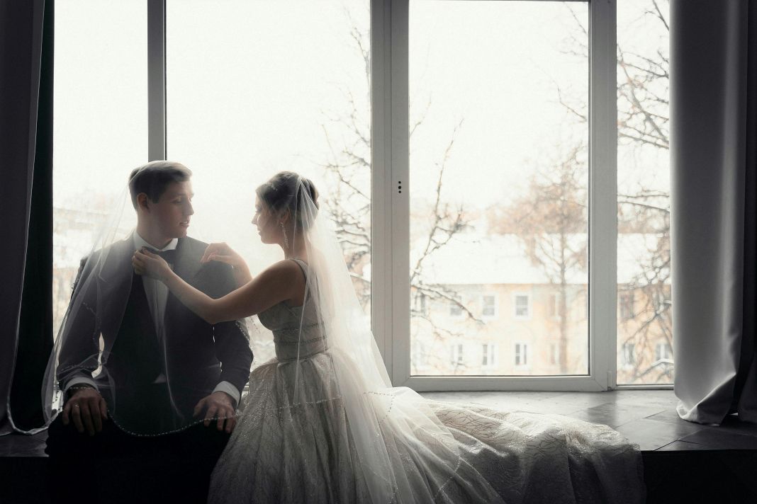 a couple enjoying a their wedding in the winter