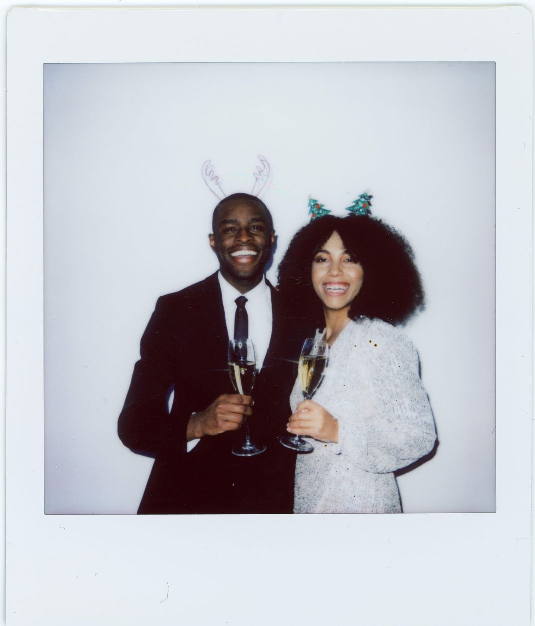A photo of a couple enjoying their christmas party in christmas party suits A photo of a couple enjoying their christmas party in christmas party suits