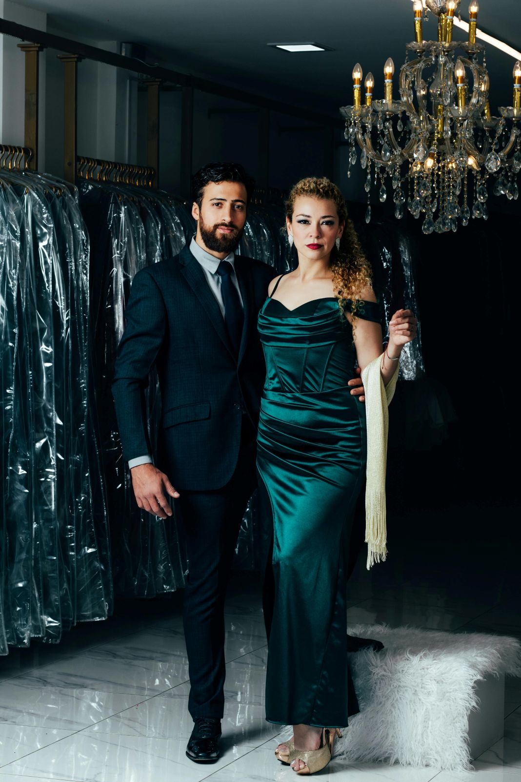 a photo of a couple wearing formal festive attire for their work christmas party