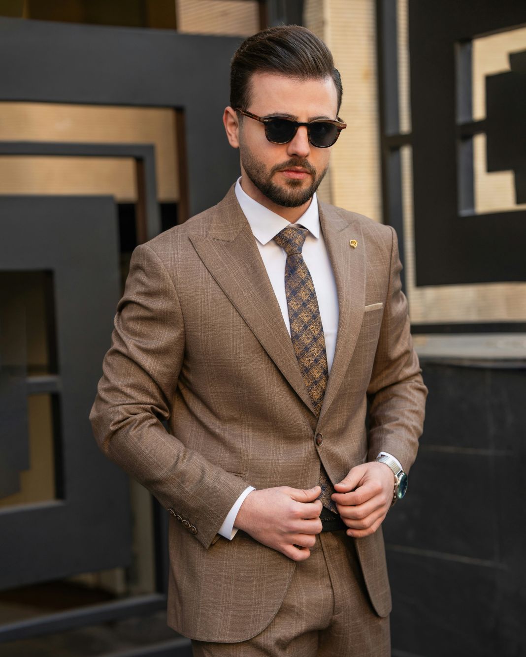 A photo of a man dressed in a flannel suit