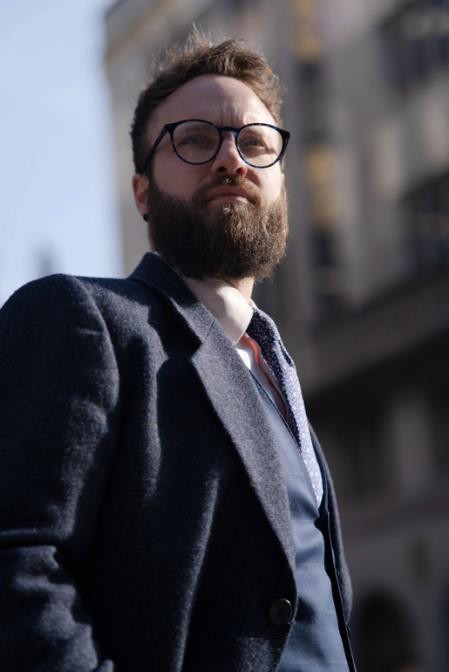 A photo of a man dressed in layers for autumn - looking smart and sophisticated