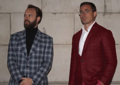 A photo of two men wearing jackets fitted to their body shape