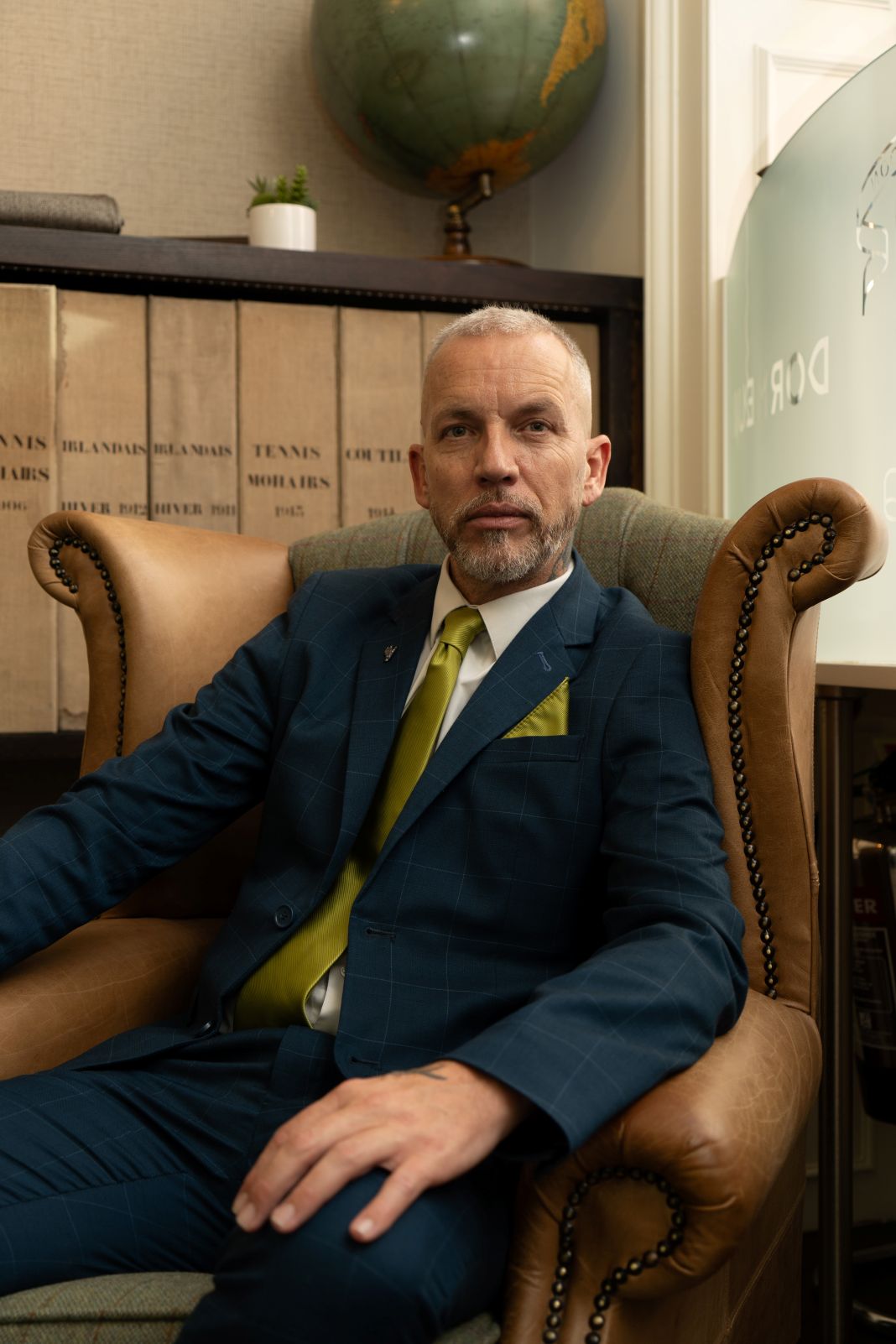 a photo of a client during a bespoke suit appointment