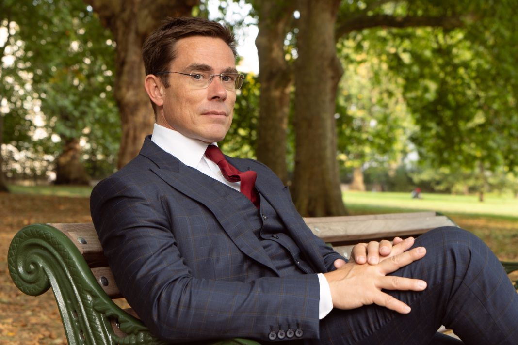 a photo of a man wearing a fielding and nicholson suit in london