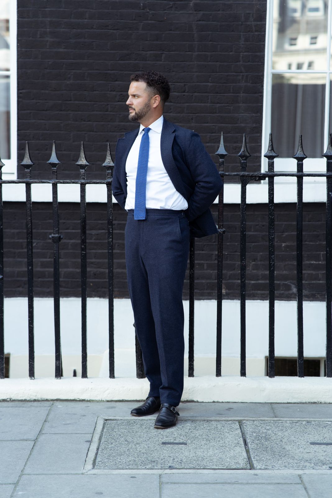 a photo of a man wearing a quality suit on first day at work a photo of a man wearing a quality suit on first day at work