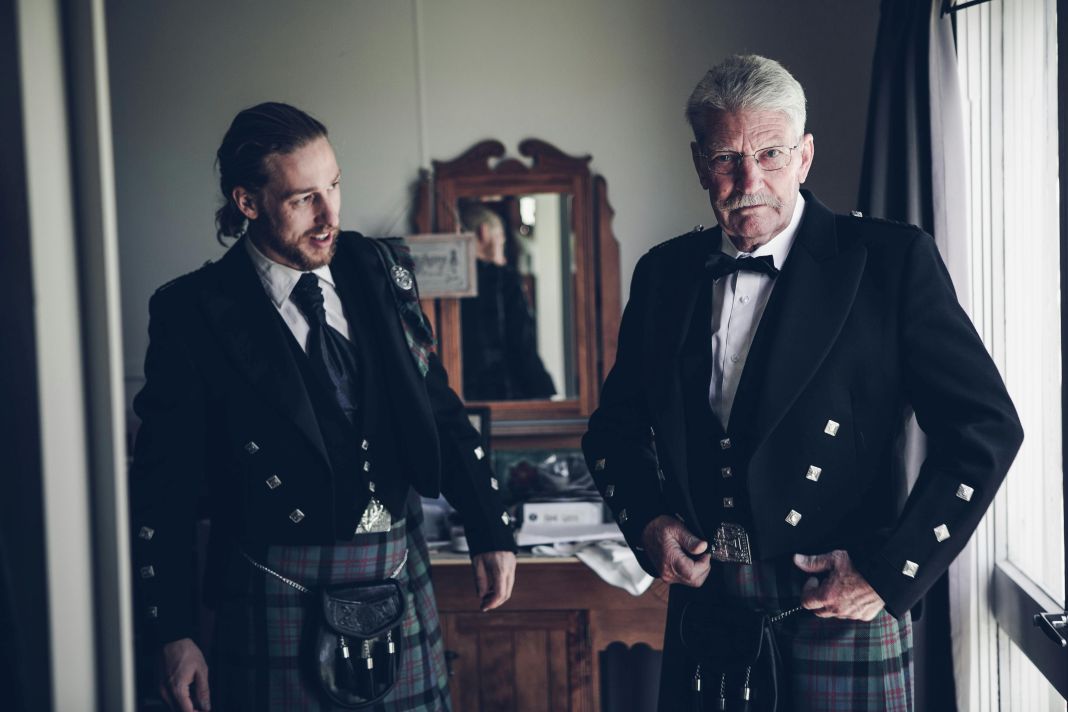 Men Wearing Scottish Kilts Getting Ready