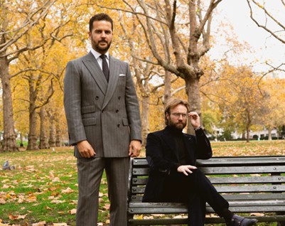 A photo of two tailors wearing skinny suits in London