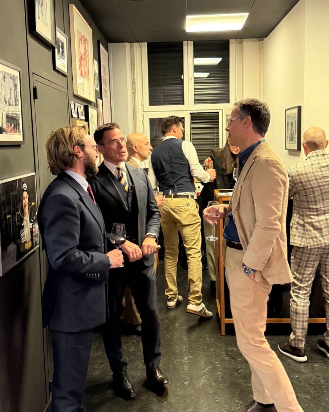 a photo of men at an event in london wearing bespoke suits