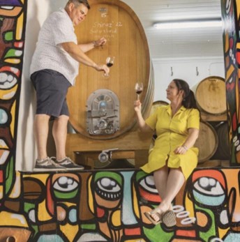 A photo of a couple enjoying tempel wine