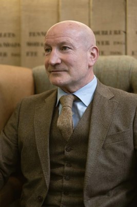 A photo of a tailoring client at Fielding & Nicholson Tailoring wearing a three piece suit