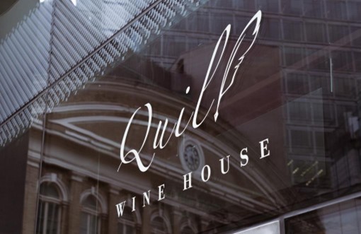 A photo of the logo outside of Quill Wine House