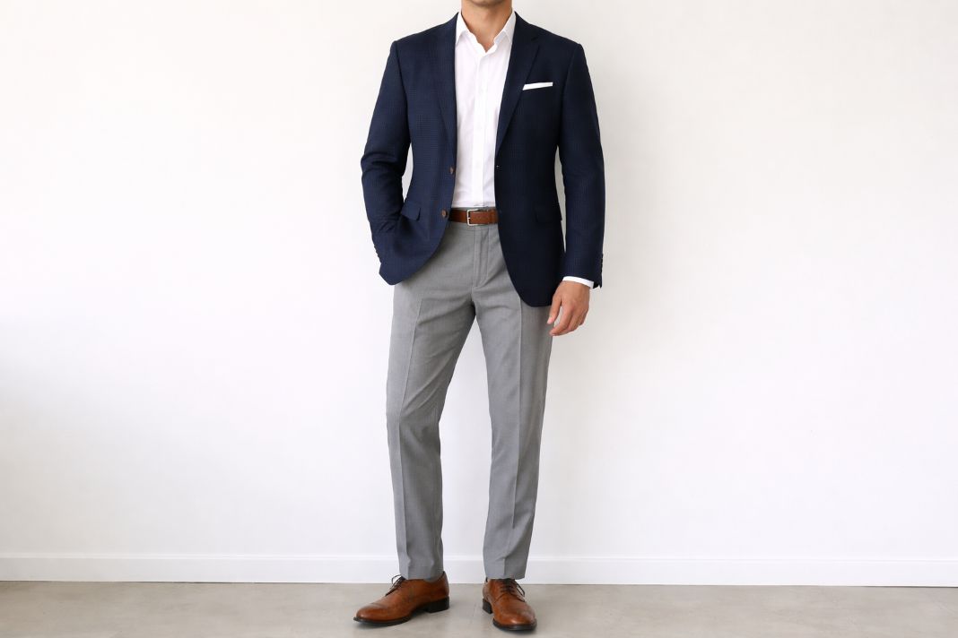 The outfit is Textured hopsack blazer (navy) + grey trousers + white shirt + brown brogues
