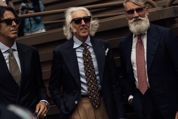 a photo of three gentlemen dressed in formal bespoke clothing