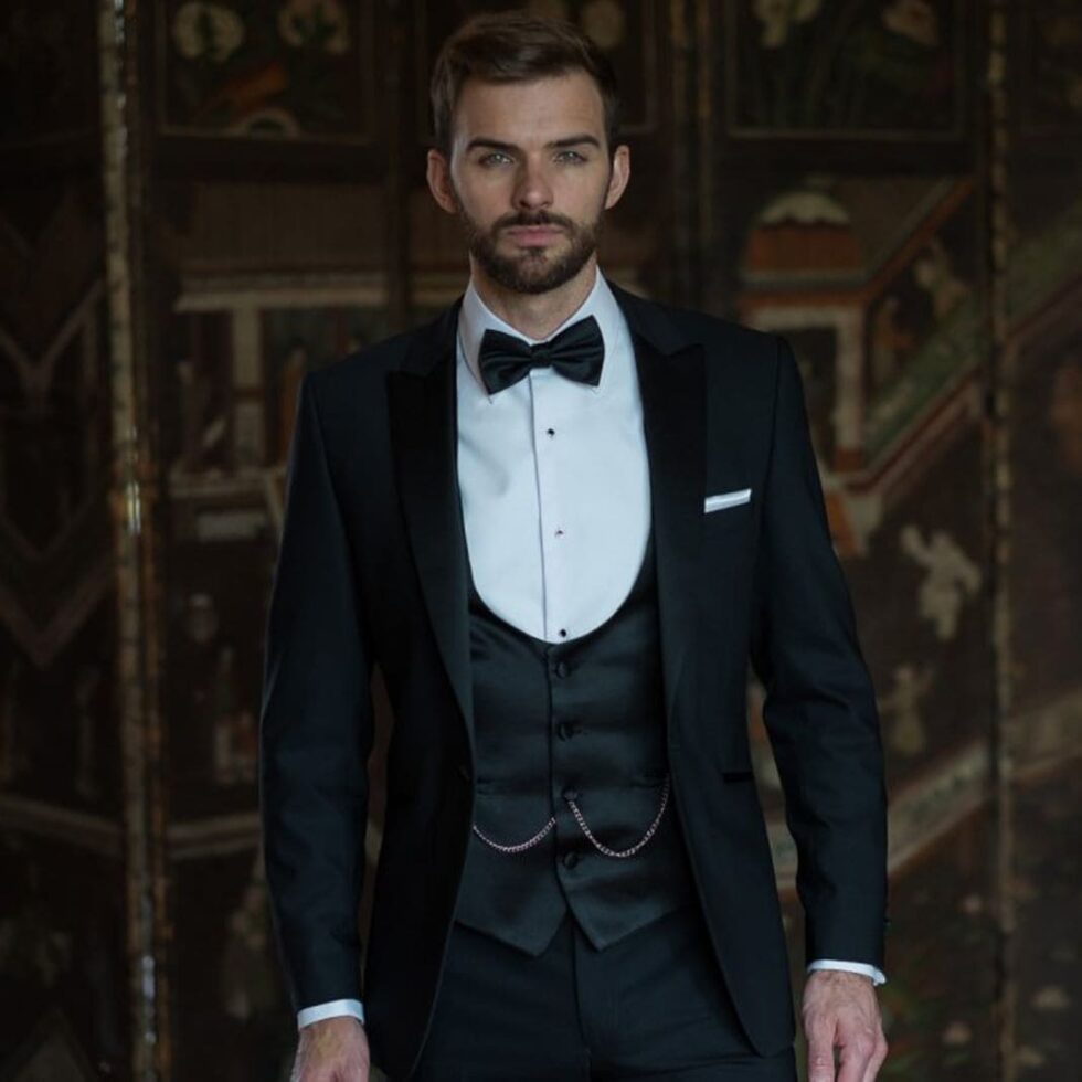 Black three-piece tuxedo worn with a bow tie, sample image