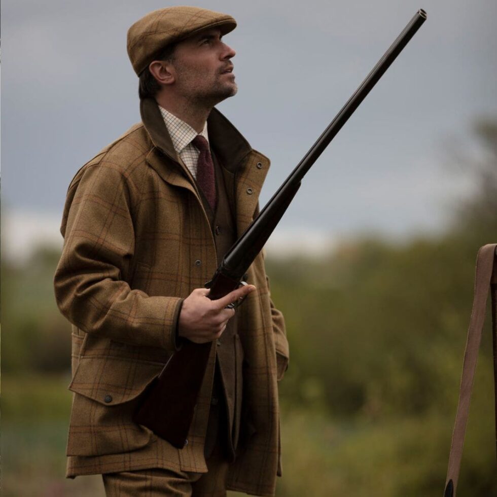 Brown tweed shooting jacket worn with a country waistcoat, sample image