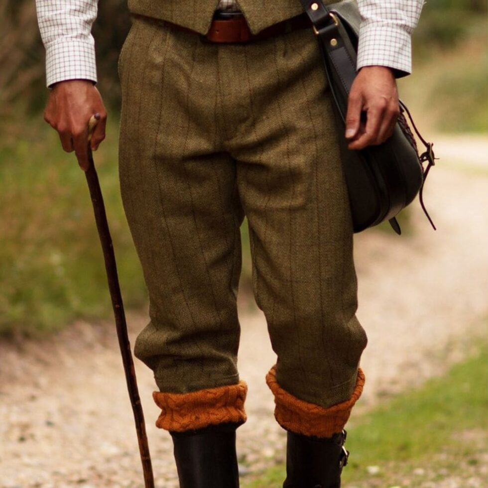 Brown tweed shooting trousers worn with a leather belt, sample image