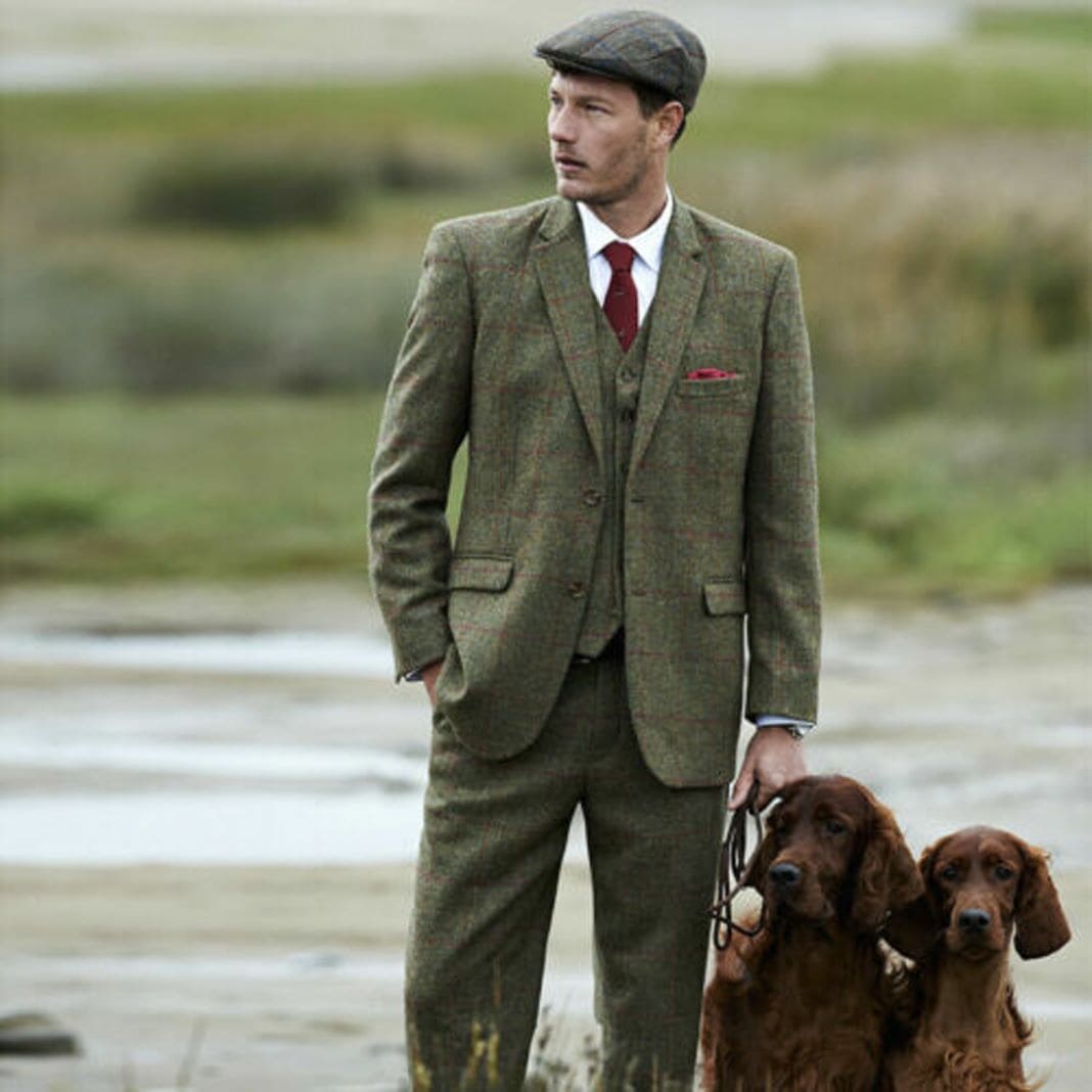 Green tweed country suit worn with a red tie, sample image