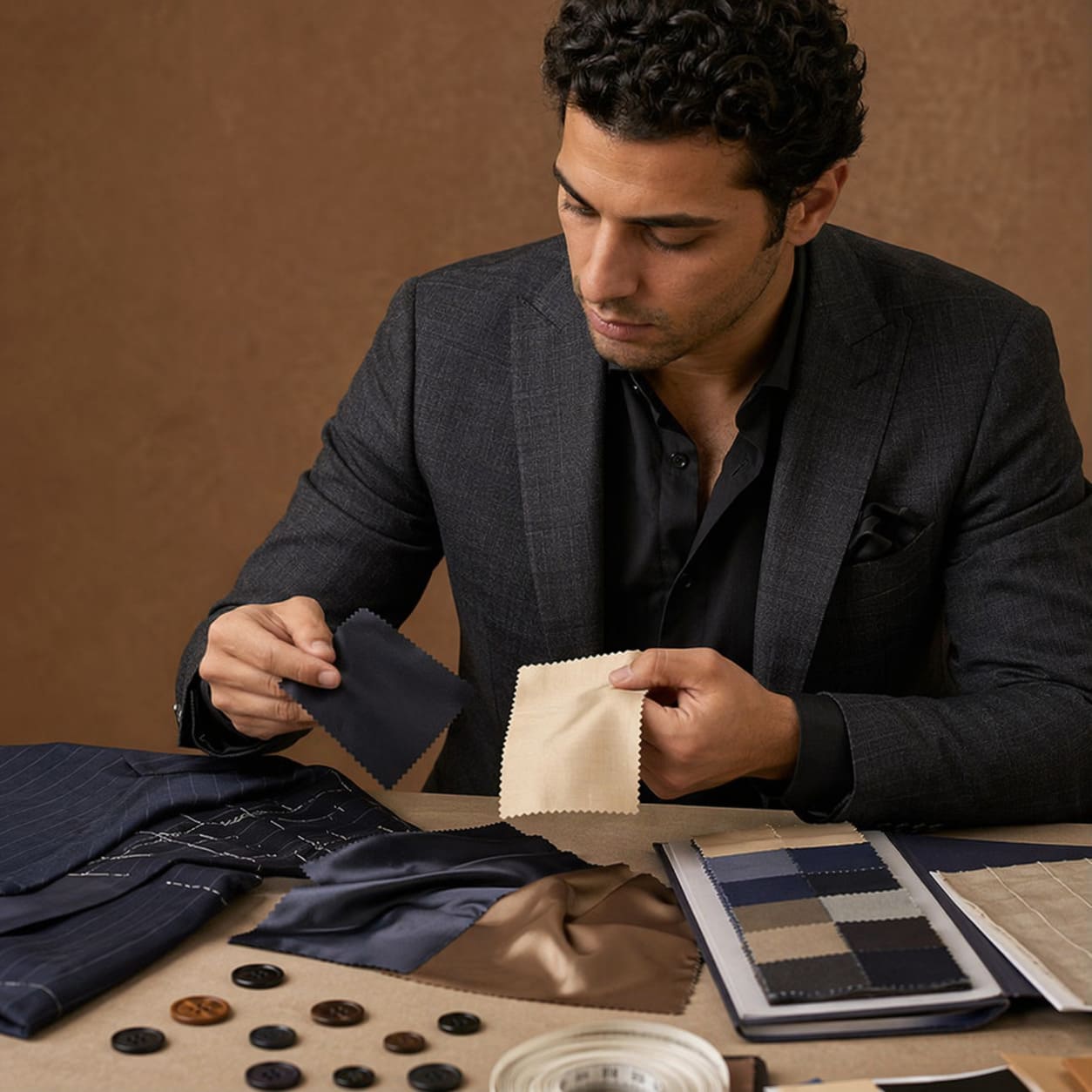 Men's Bespoke – Dark tailored blazer with fabric swatches and styling details – Sample Image