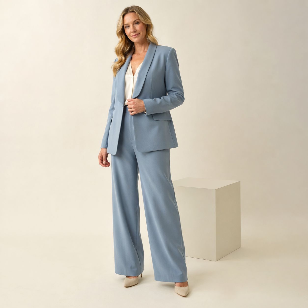 Light blue tailored blazer worn with wide-leg trousers