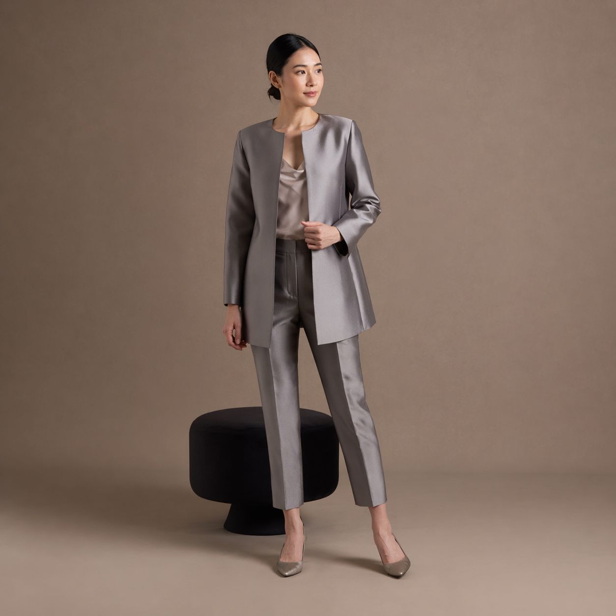 Grey tailored blazer worn with cropped trousers