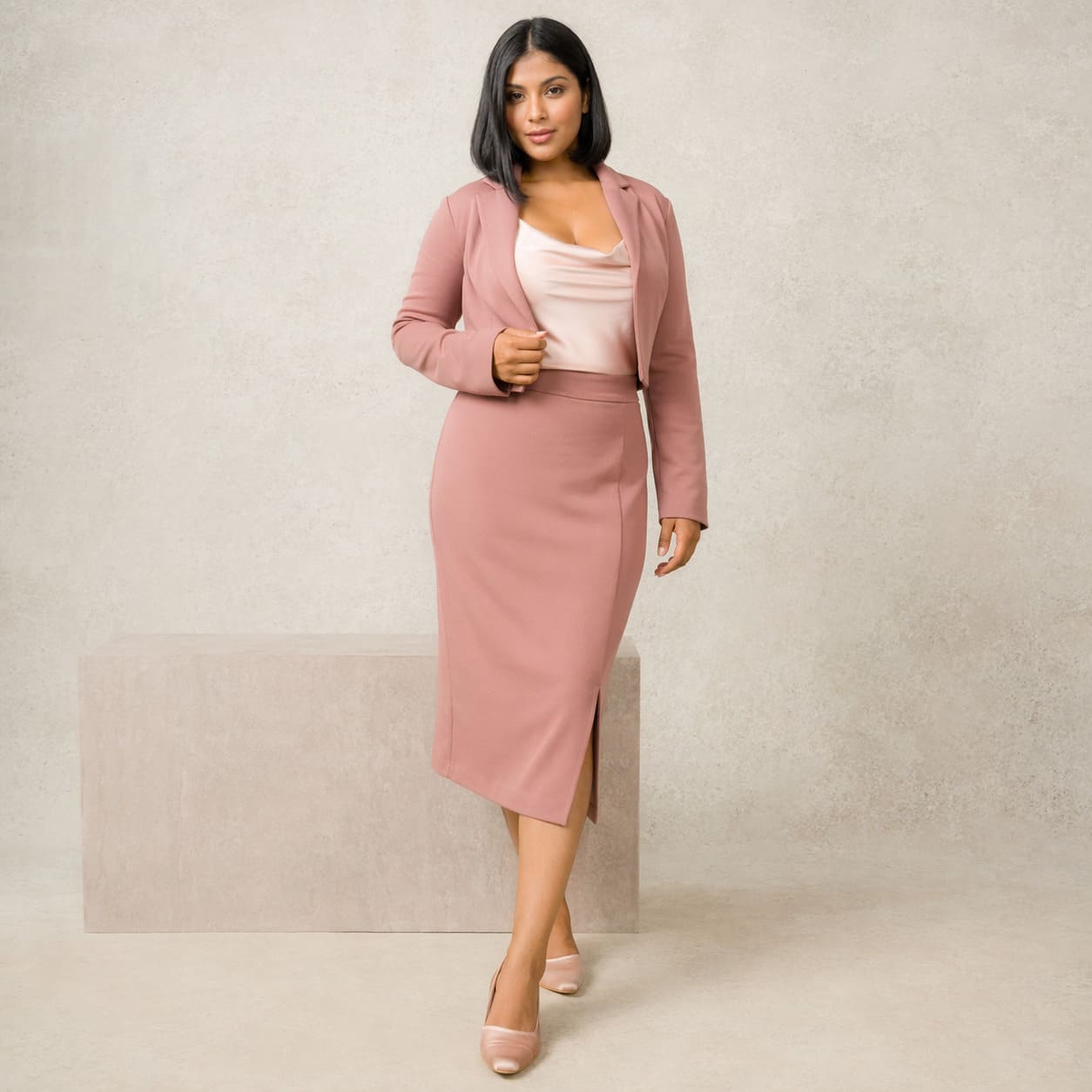 Blush pink fitted midi dress with a matching jacket