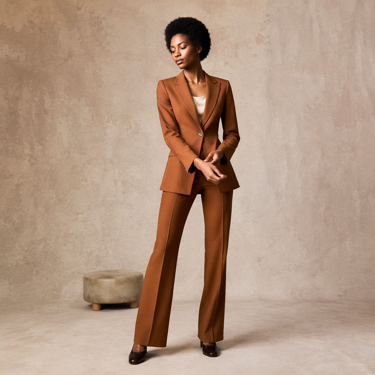 Brown tailored blazer worn with flared trousers