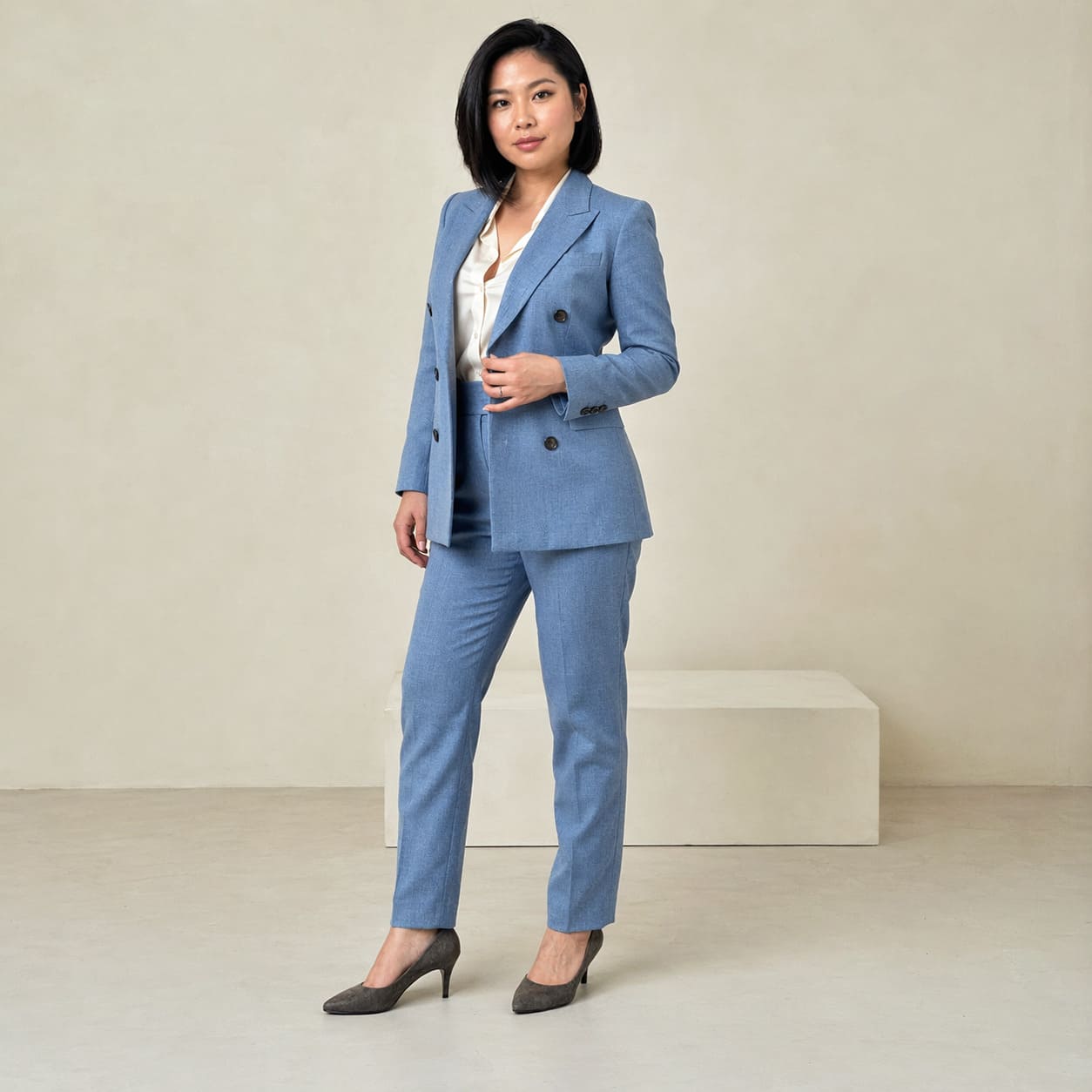 Light blue tailored blazer worn with slim fit trousers
