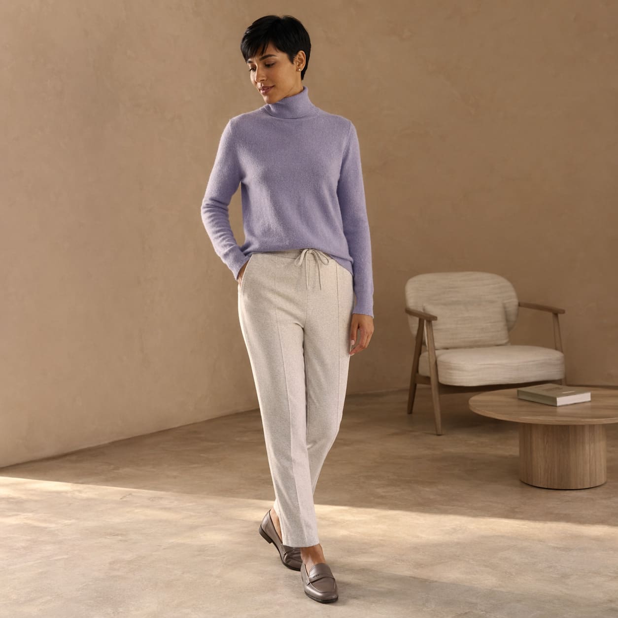 Lavender knit sweater worn with light neutral trousers, sample image