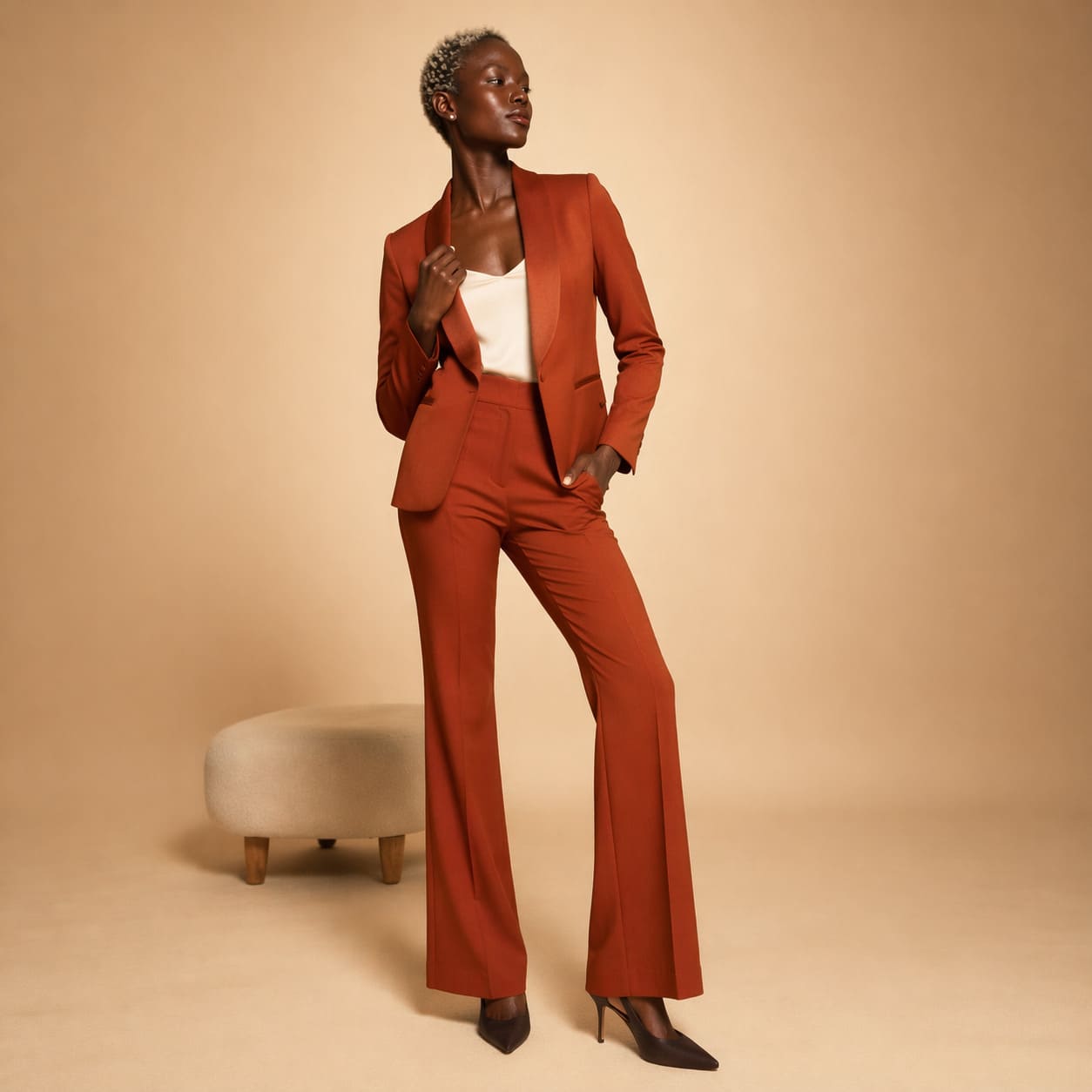 Rust tailored blazer worn with flared trousers