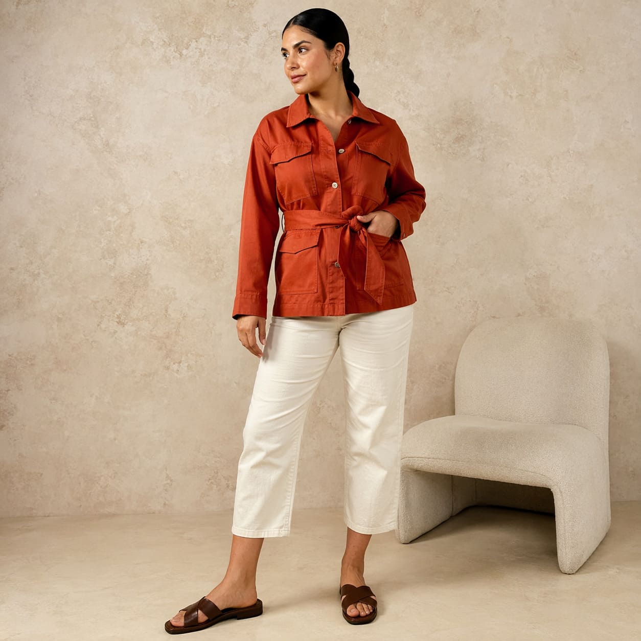Burnt orange belted utility jacket worn with cropped trousers, sample image