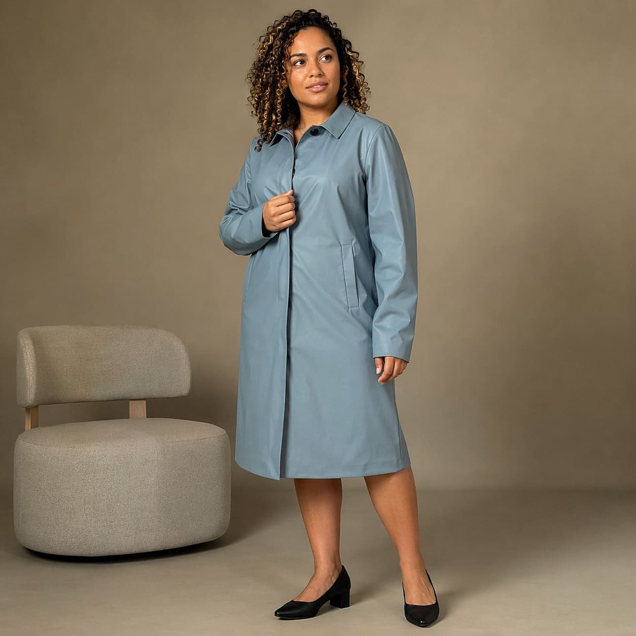 Light blue buttoned coat with a clean, minimal front, sample image