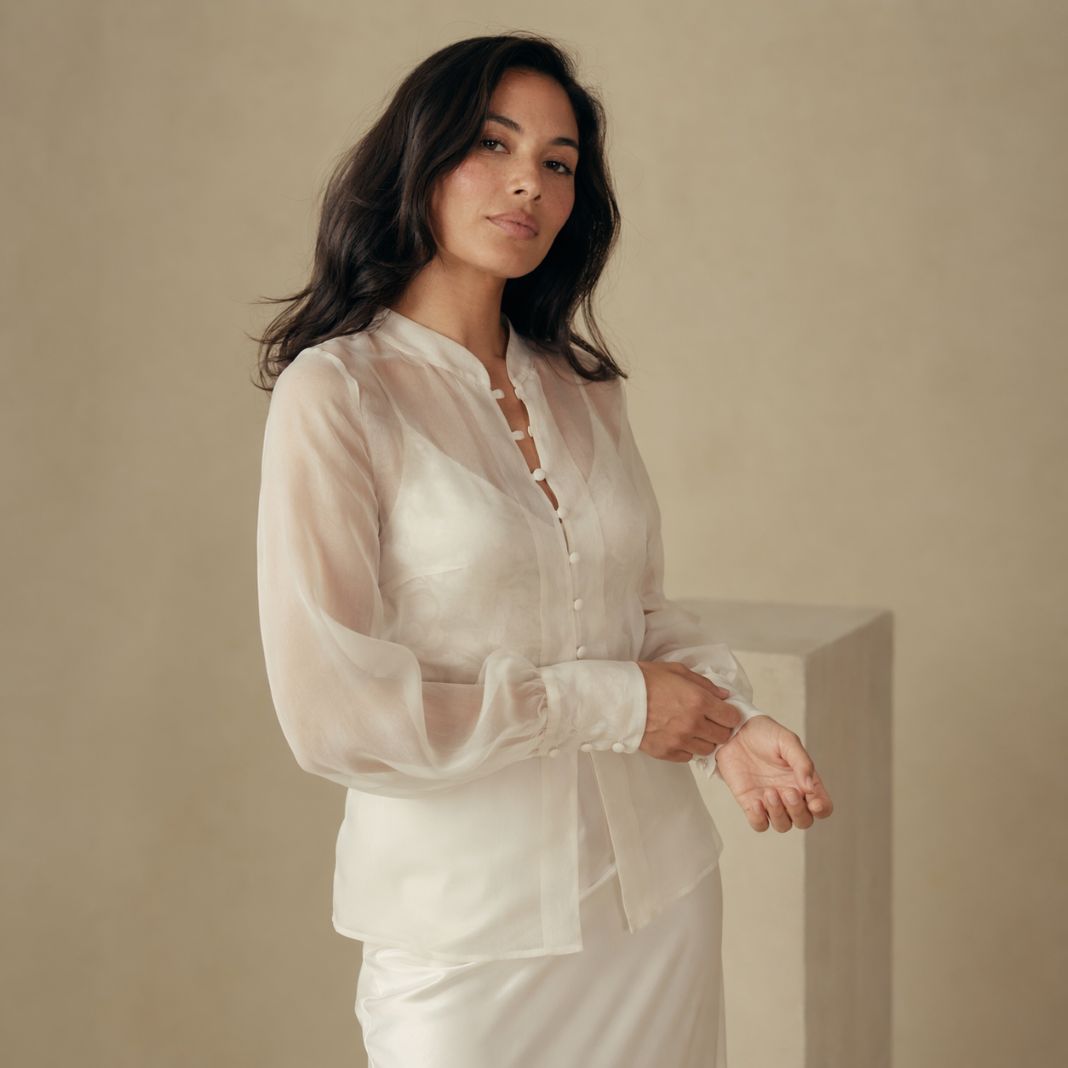 Cream sheer blouse with soft drape detailing