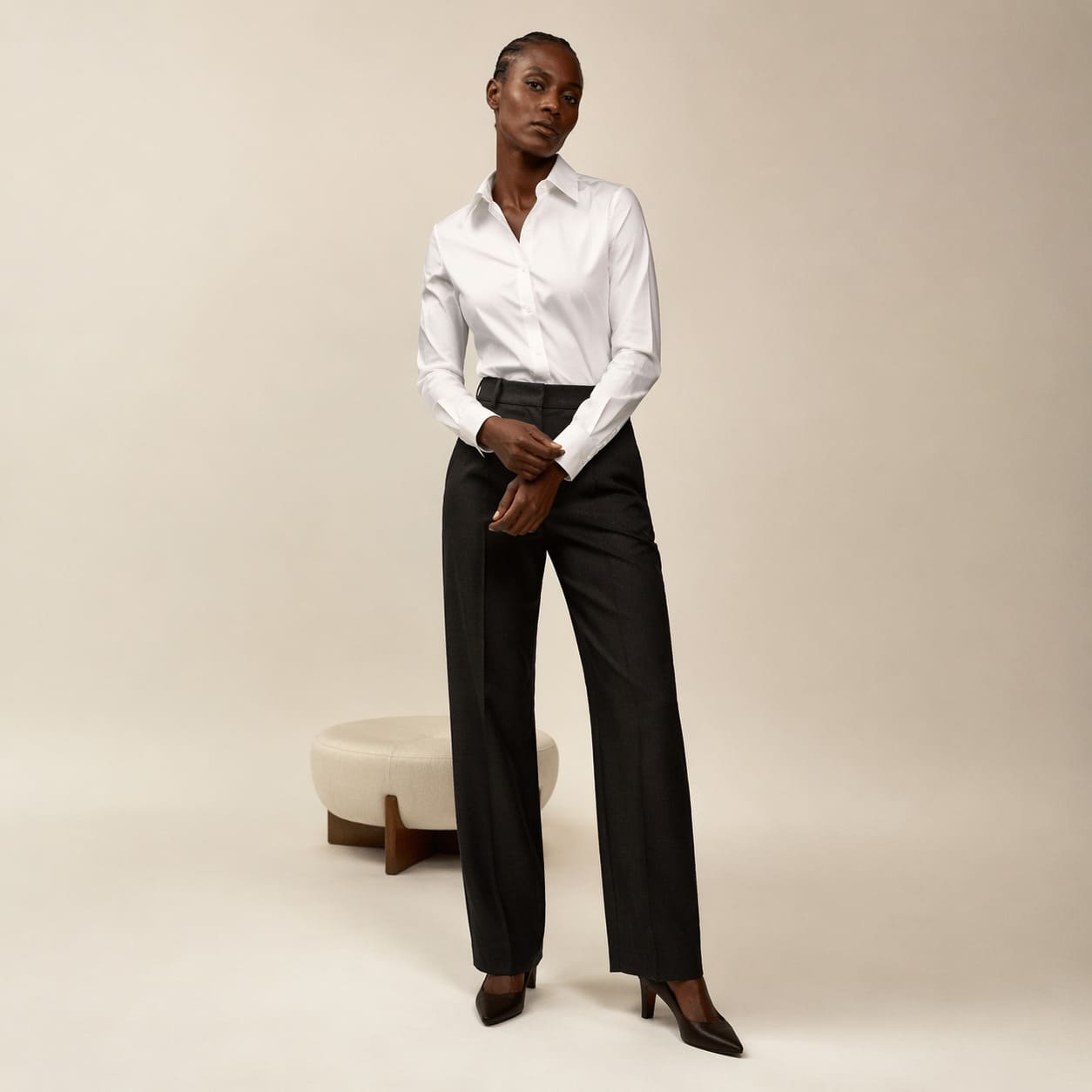 White button-up shirt worn with black wide-leg trousers
