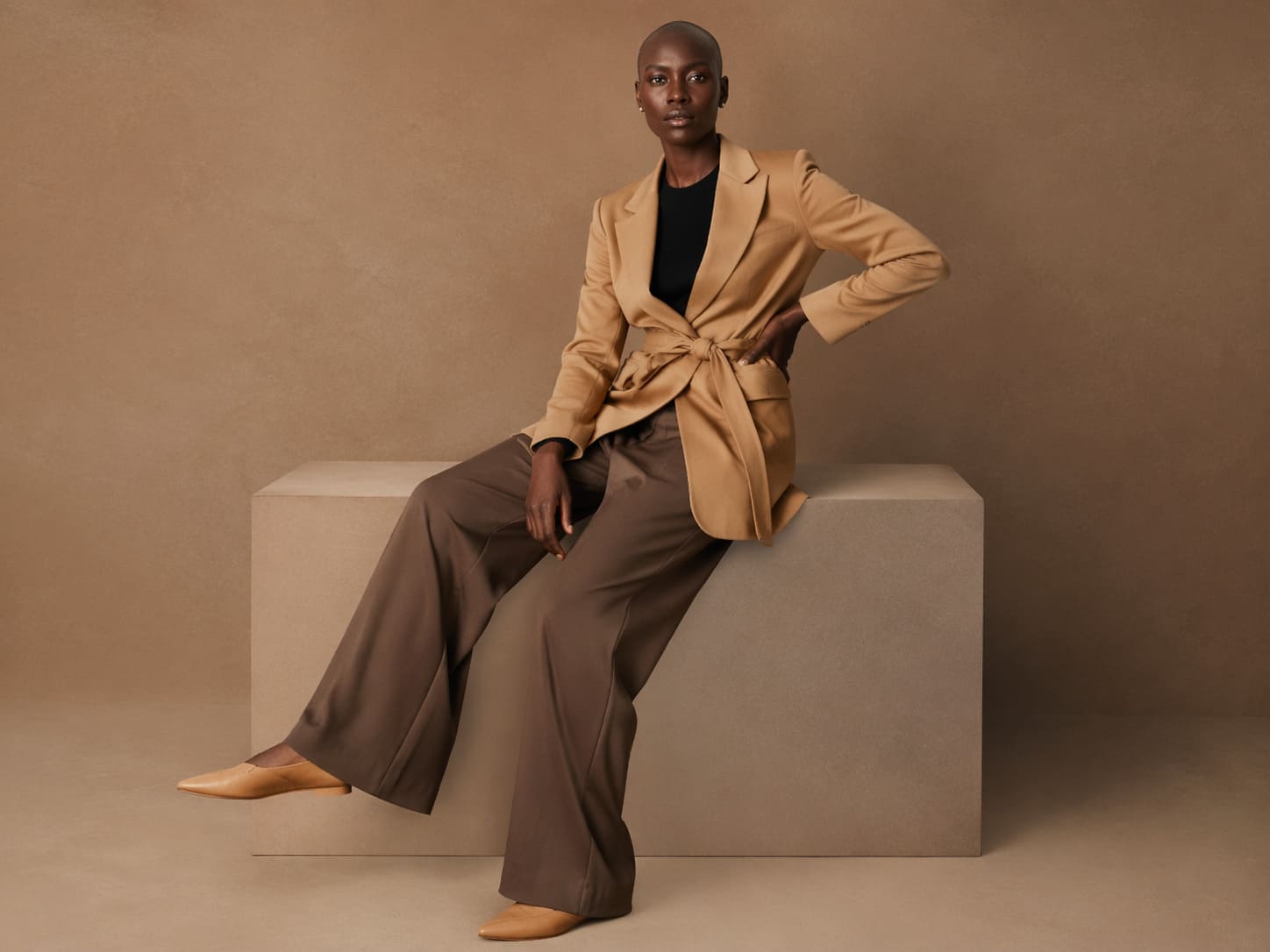 Camel blazer worn with brown wide-leg trousers, sample image
