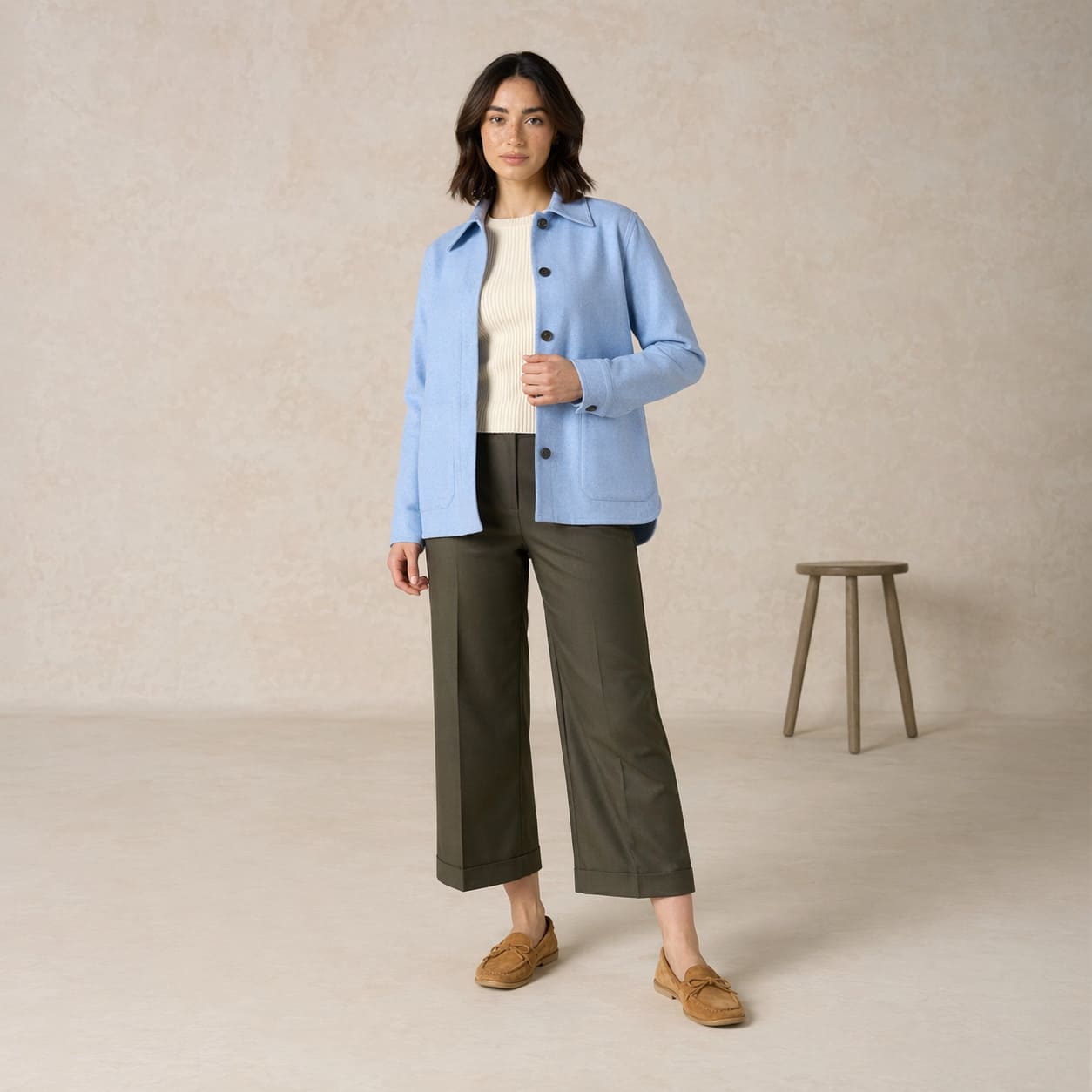 Light blue blazer worn with a white top and olive trousers, sample image