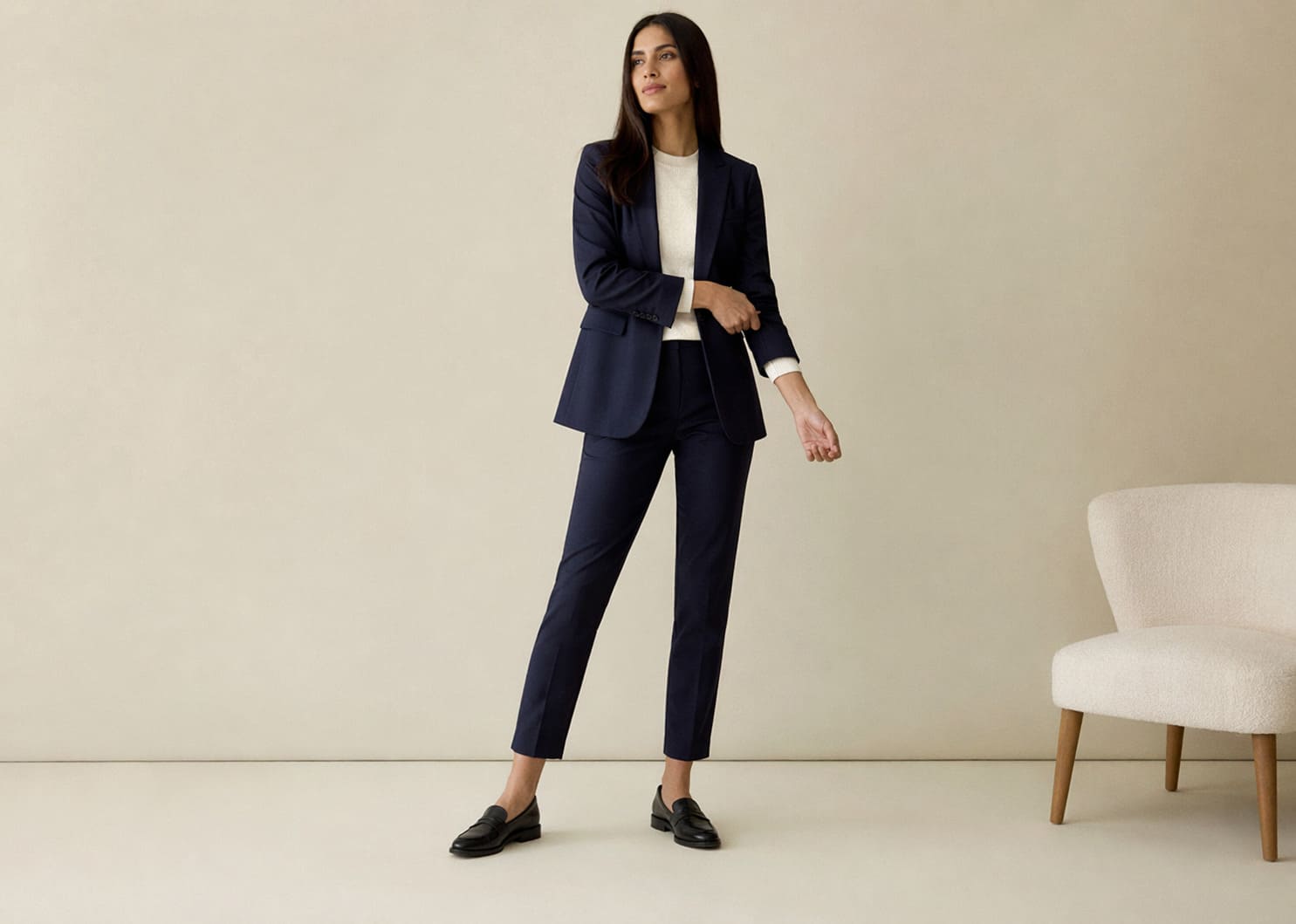 Navy tailored blazer worn with slim-fit trousers, sample image