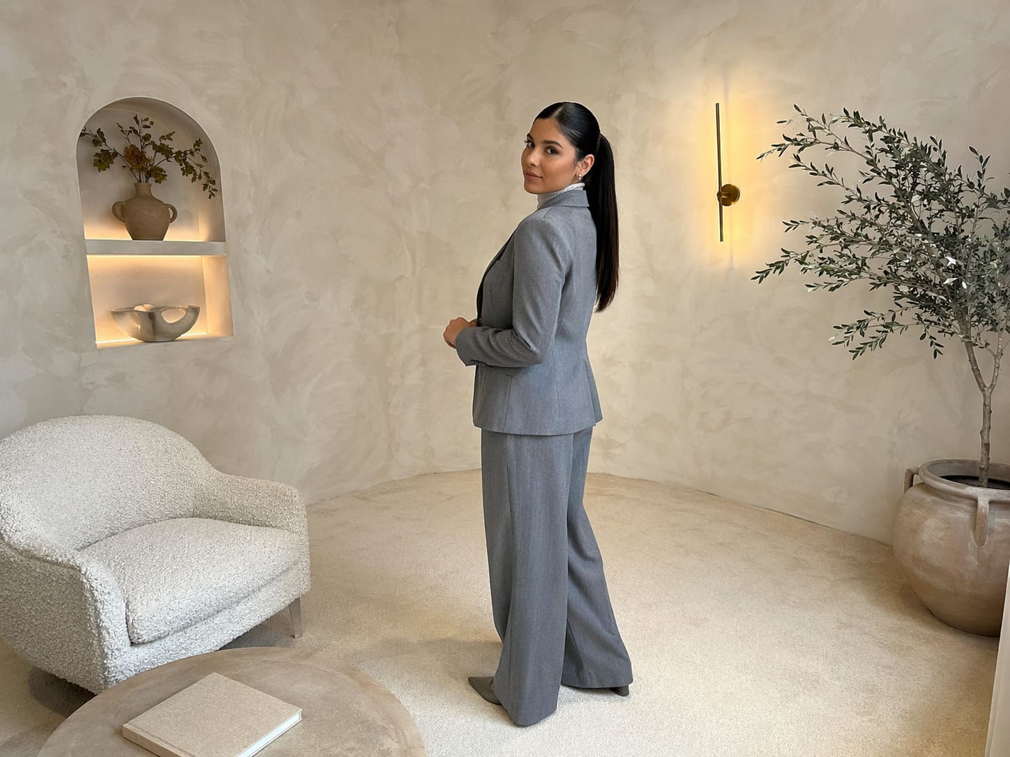 Grey tailored blazer worn with straight-leg trousers
