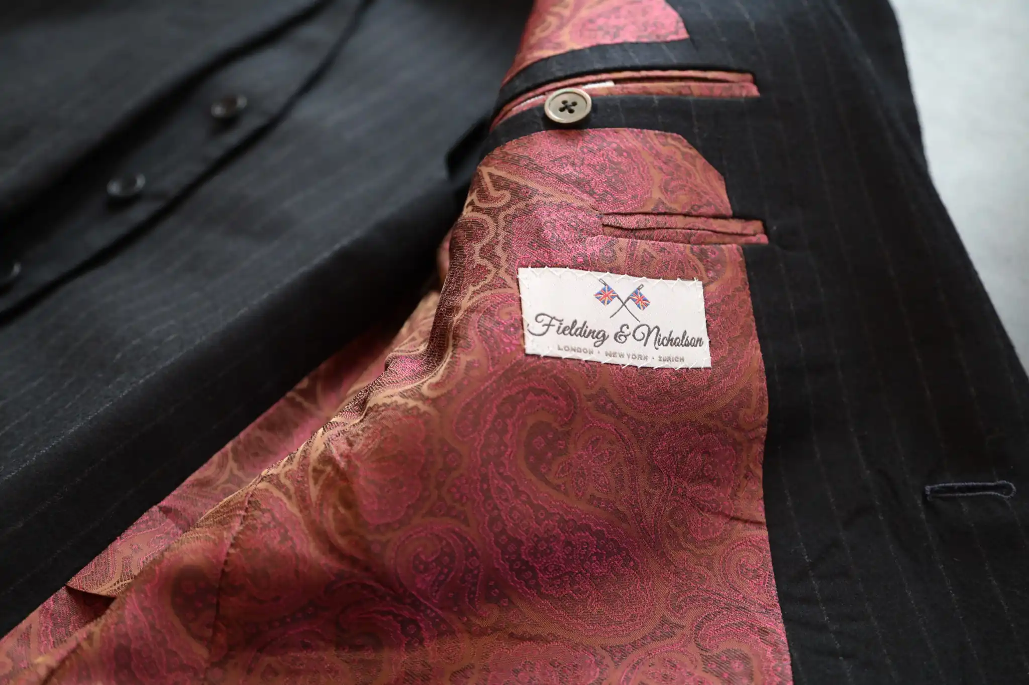 Bespoke jacket lining in red paisley silk with the Fielding and Nicholson label