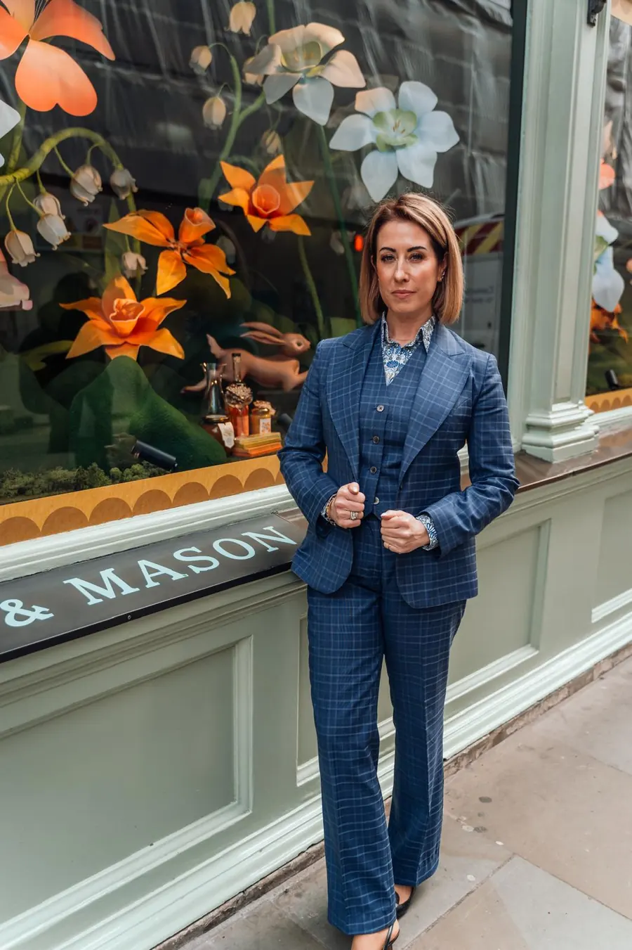 Blue checked women's trouser suit with a tailored jacket