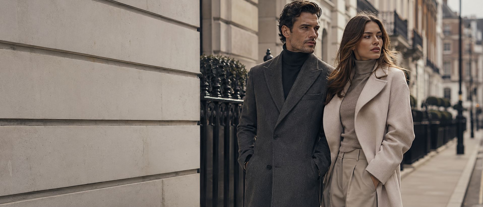 A couple walking together in tailored clothing